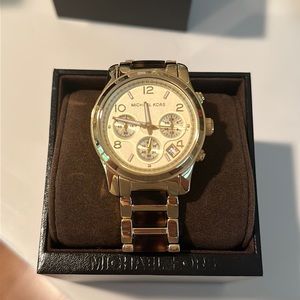 Michael Kor’s tortoise shell gold Watch